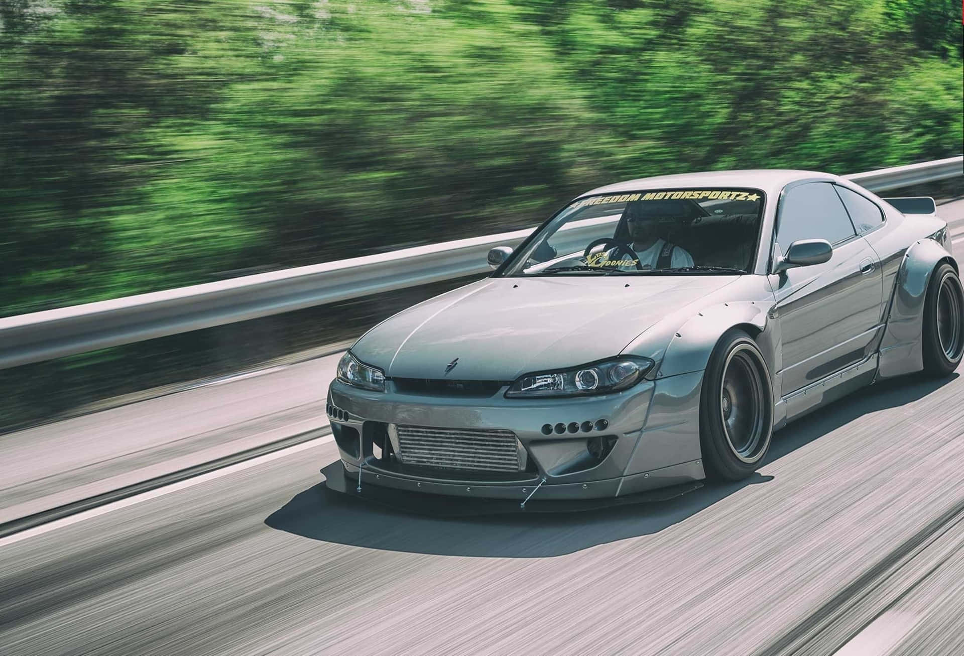 Feel the power of Nissan Silvia S15 on the road Wallpaper