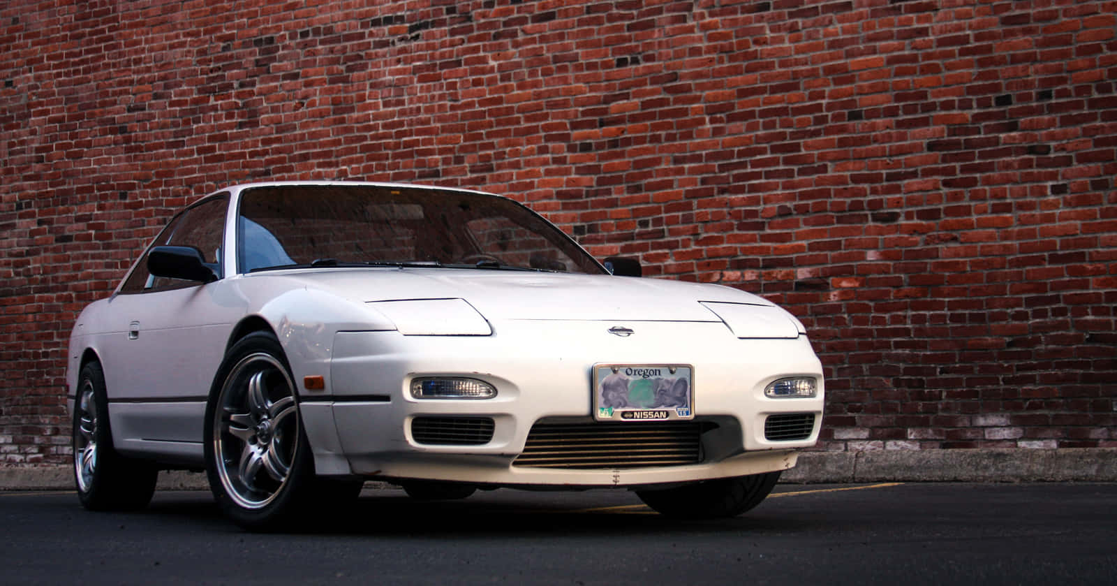 Nissan240sx Silver Coupe Brick Backdrop Wallpaper