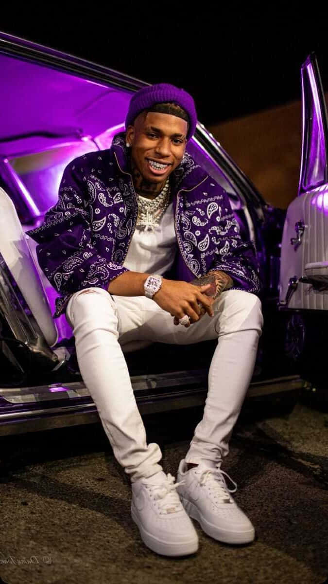 Download NLE Choppa posing in a stylish outfit