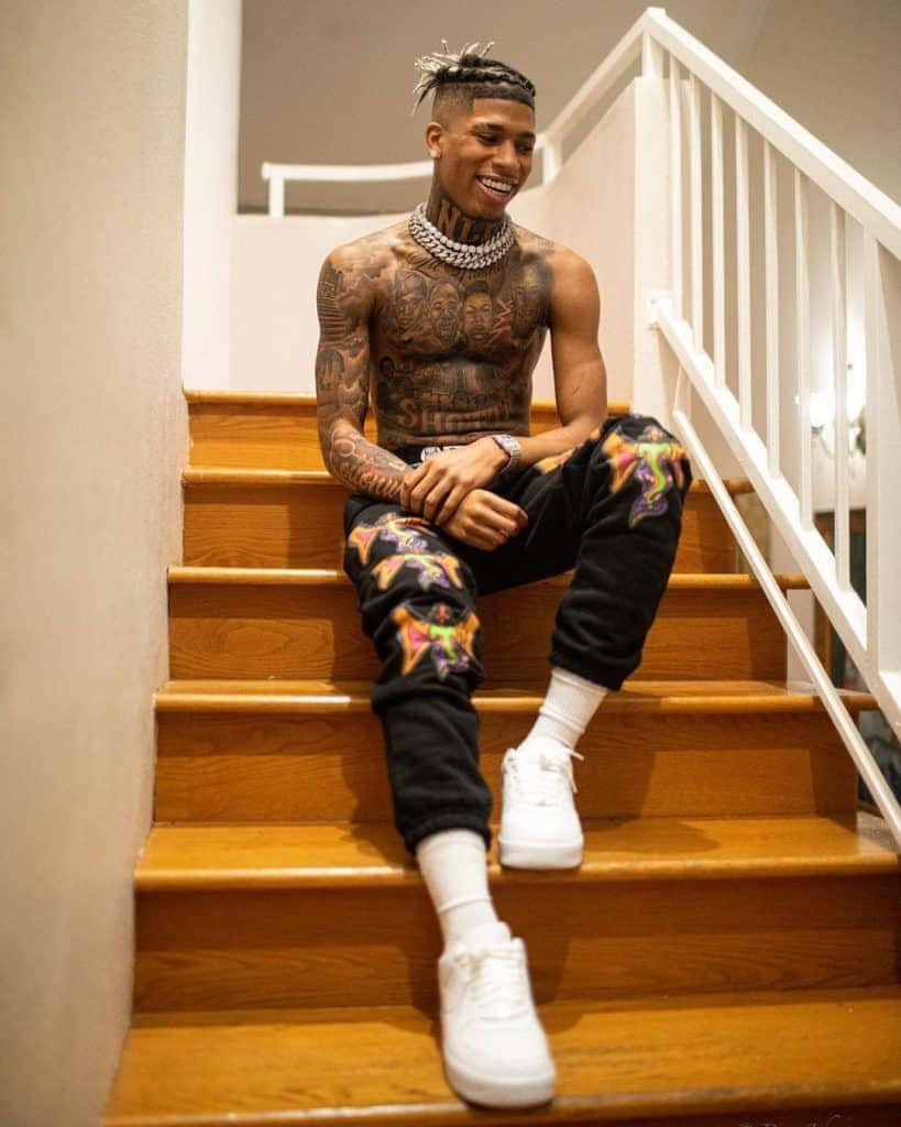 Download NLE Choppa posing in a stylish outfit | Wallpapers.com