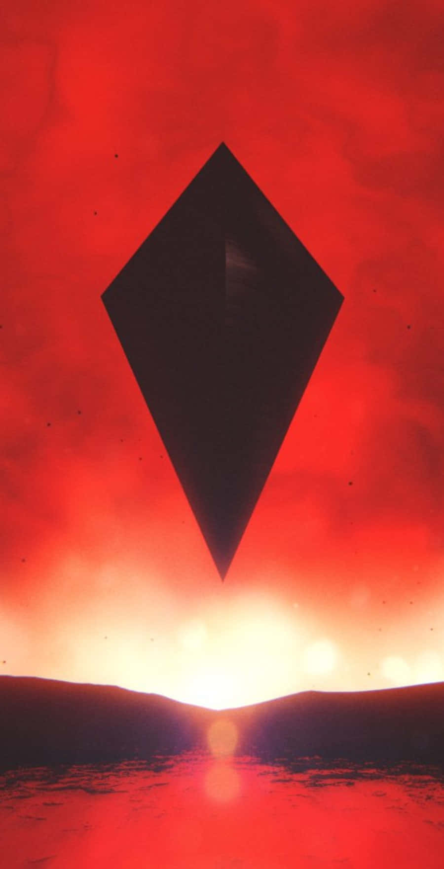 A Black Diamond In The Sky With A Red Sunset Wallpaper