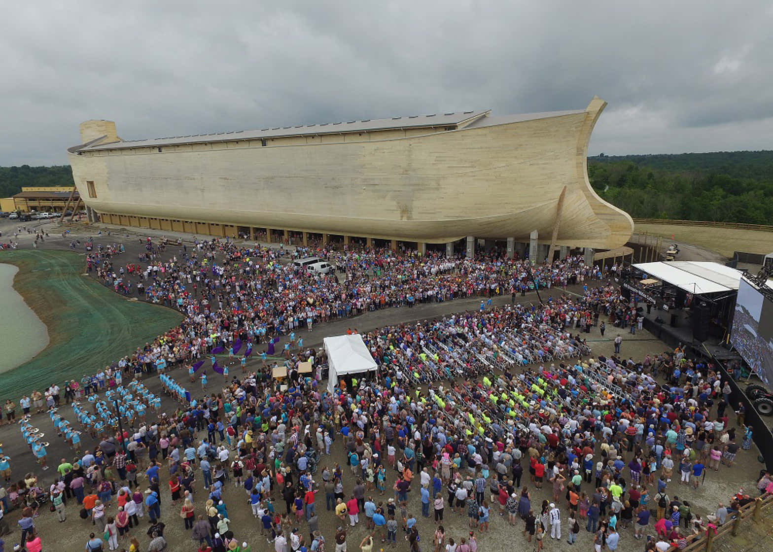 A Large Crowd Gathers Around A Large Ark