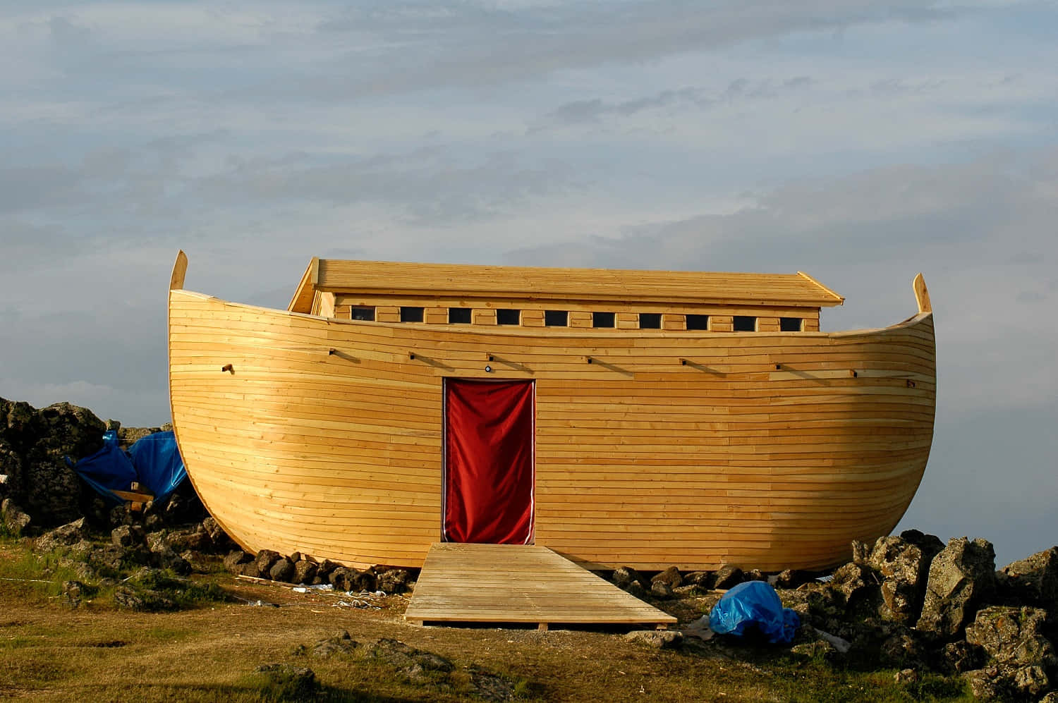 A Wooden Boat Is Sitting On Top Of A Hill