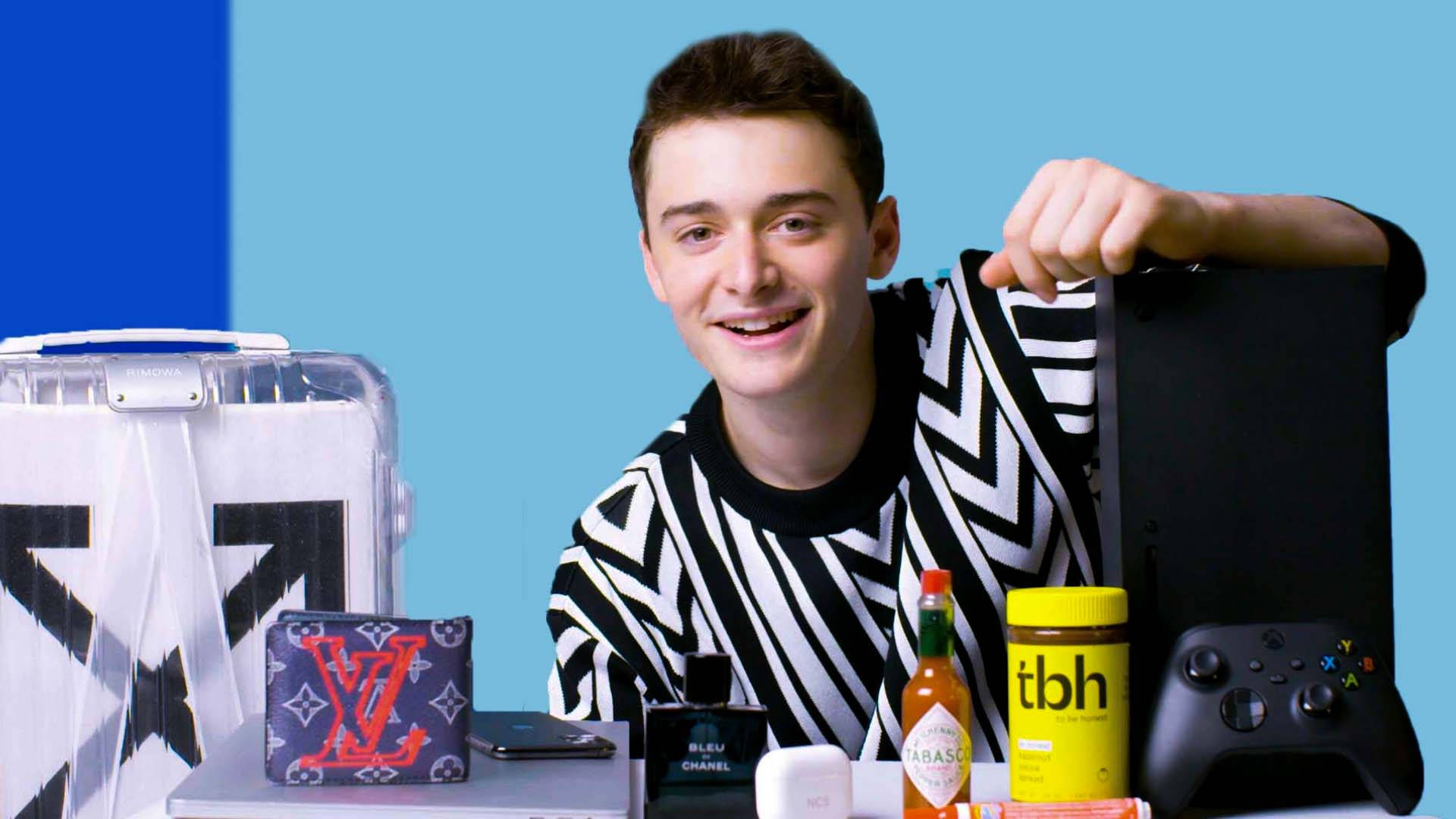 Noah Schnapp With Things He Can't Live Without Wallpaper
