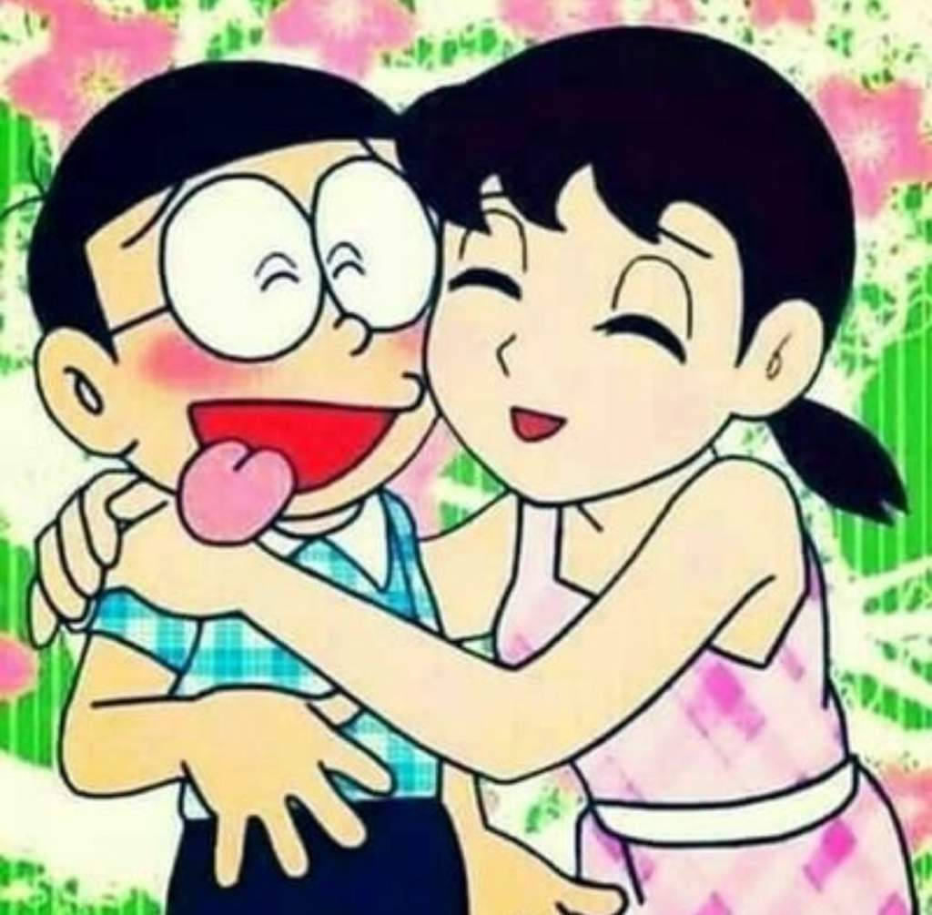 Históriade Amor Do Nobita E Da Shizuka Com Fundo Floral. Papel de Parede