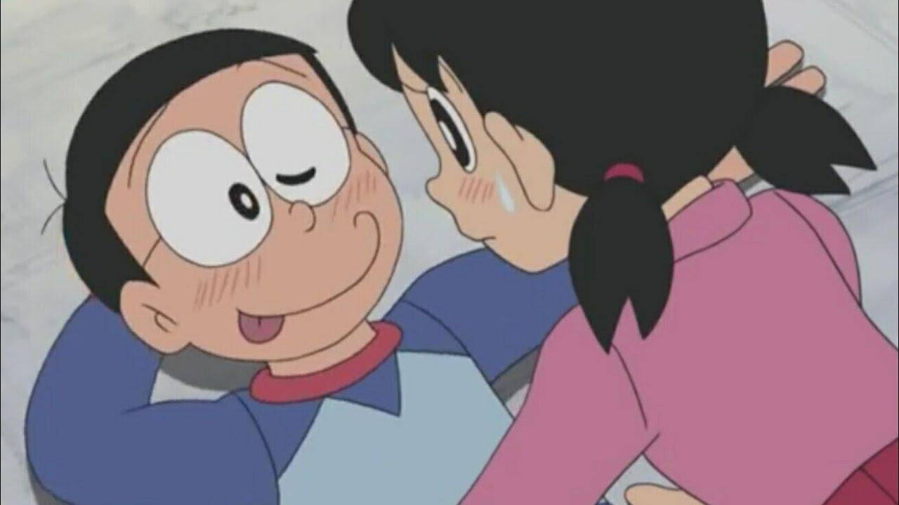 Históriade Amor Entre Nobita E Shizuka Com Piscadela Para Usar Como Papel De Parede Do Computador Ou Celular. Papel de Parede