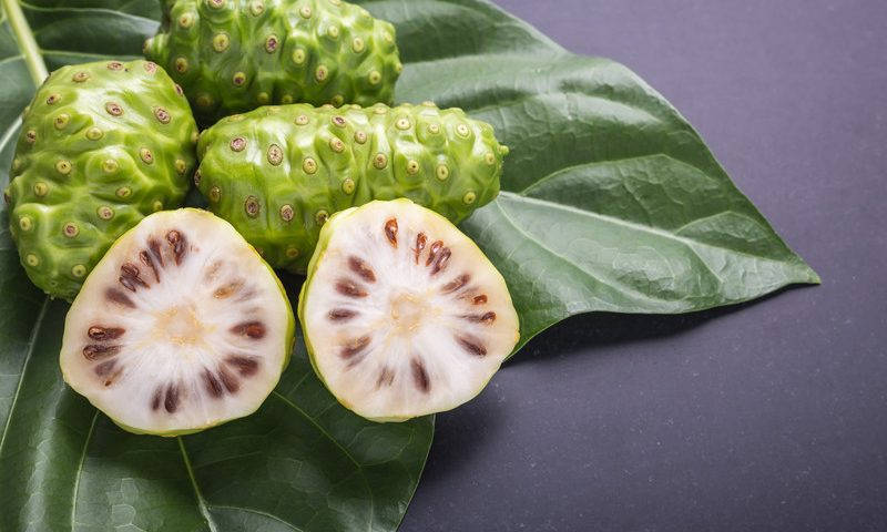 Noni Fruits On A Gray Table Wallpaper