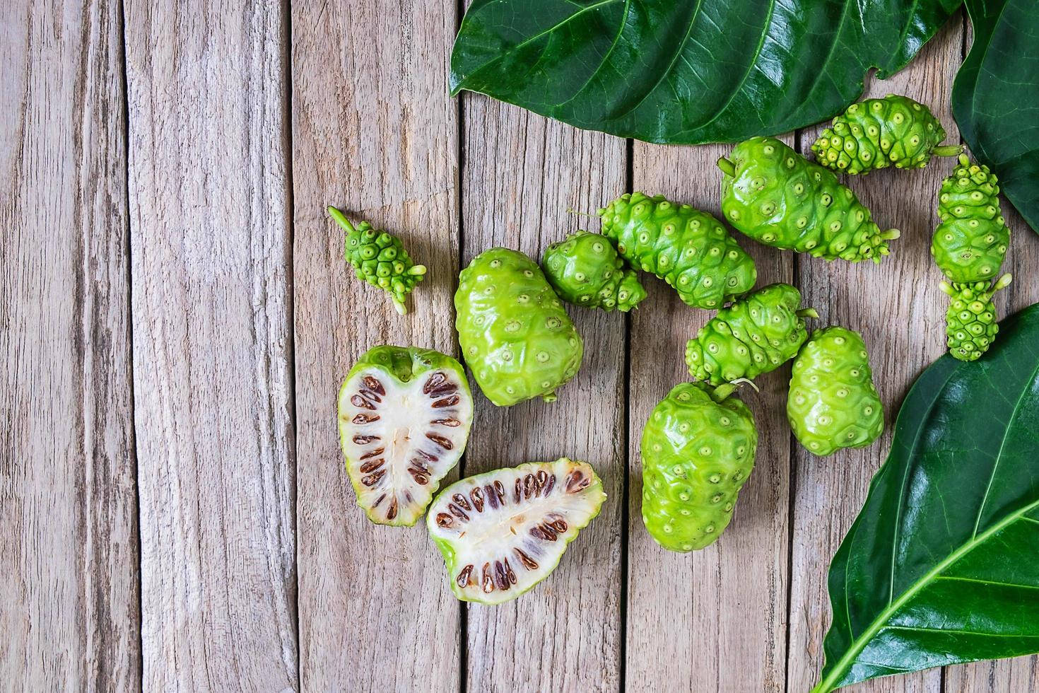 Noni Fruits On Wooden Table Wallpaper