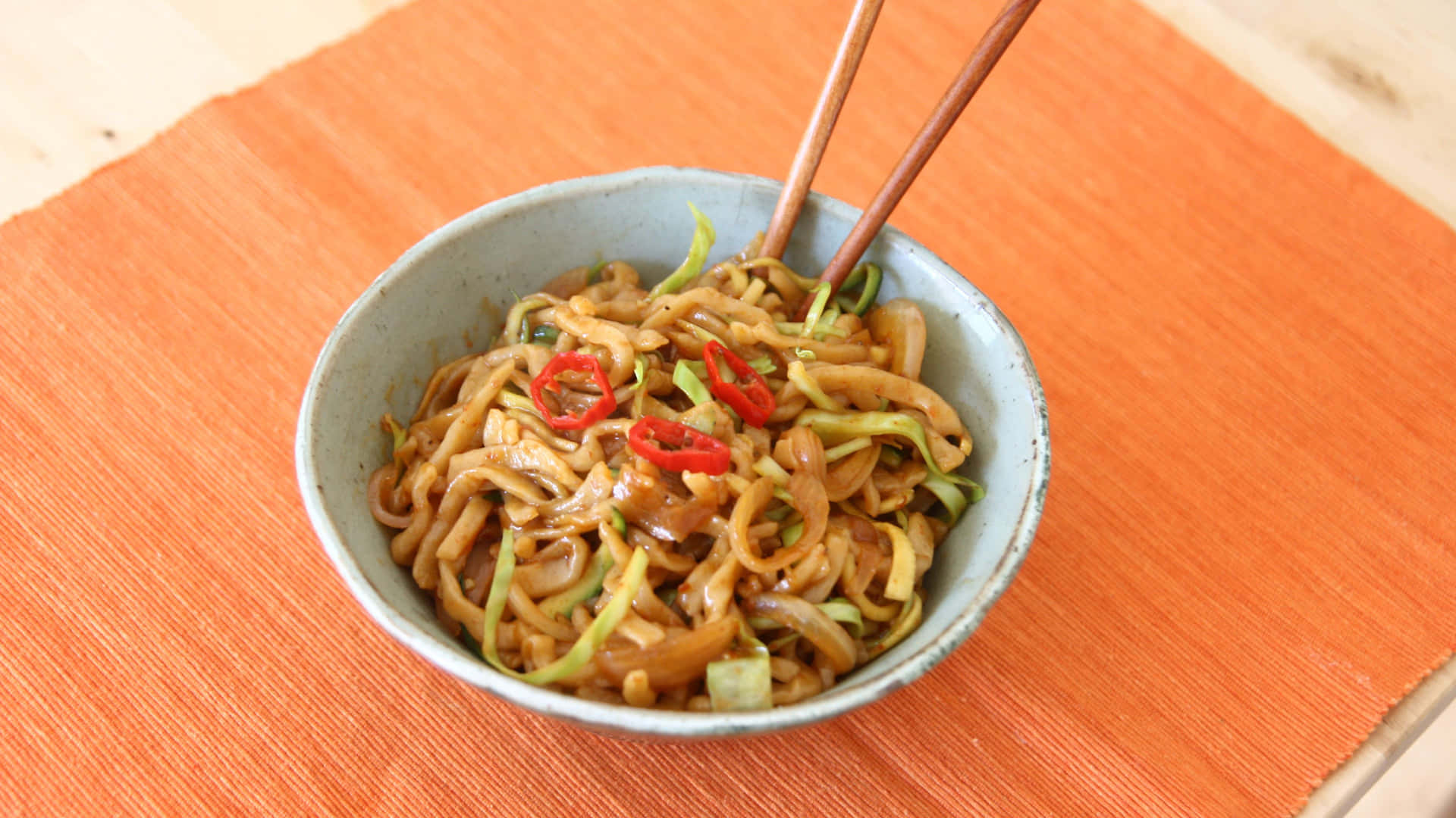 Colorful Bowls of Noodles on Wooden Table