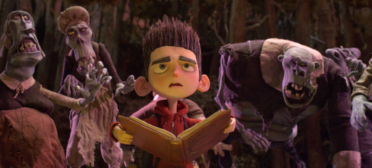 Paranorman's Norman engrossed in reading an enchanting book Wallpaper