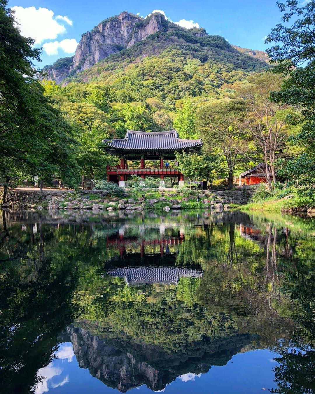 A Pagoda Reflected In A Pond