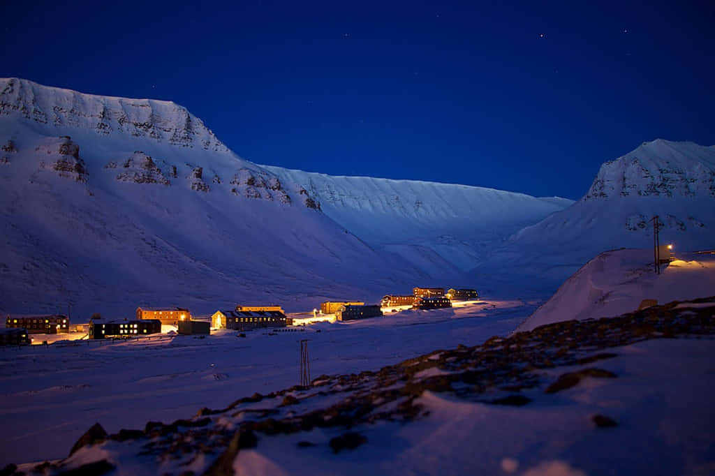 Imagende Un Tranquilo Pueblo Del Polo Norte Durante La Noche.