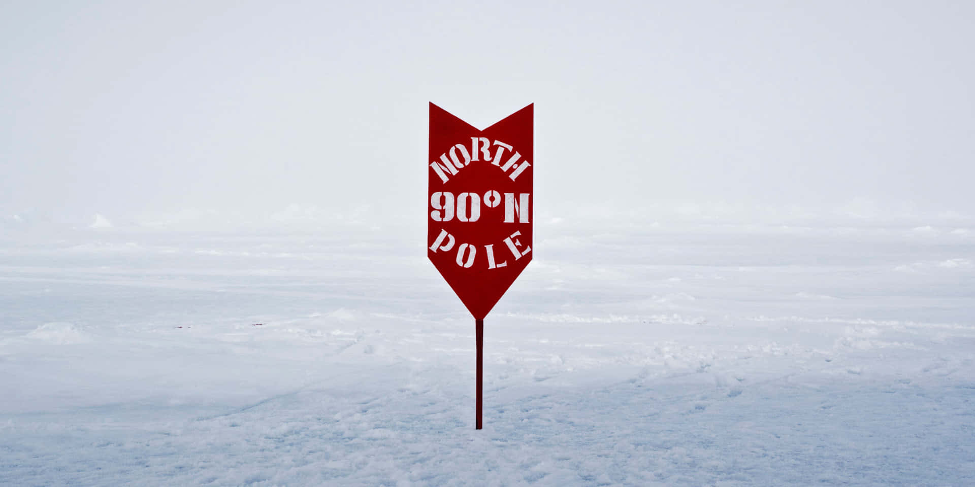 A Red Sign With The Words North Pole