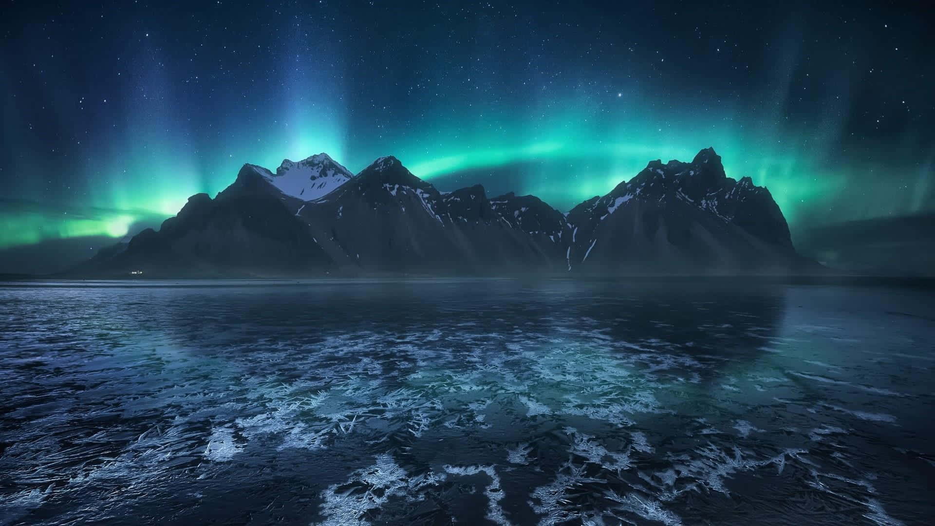 the aurora borealis over a mountain