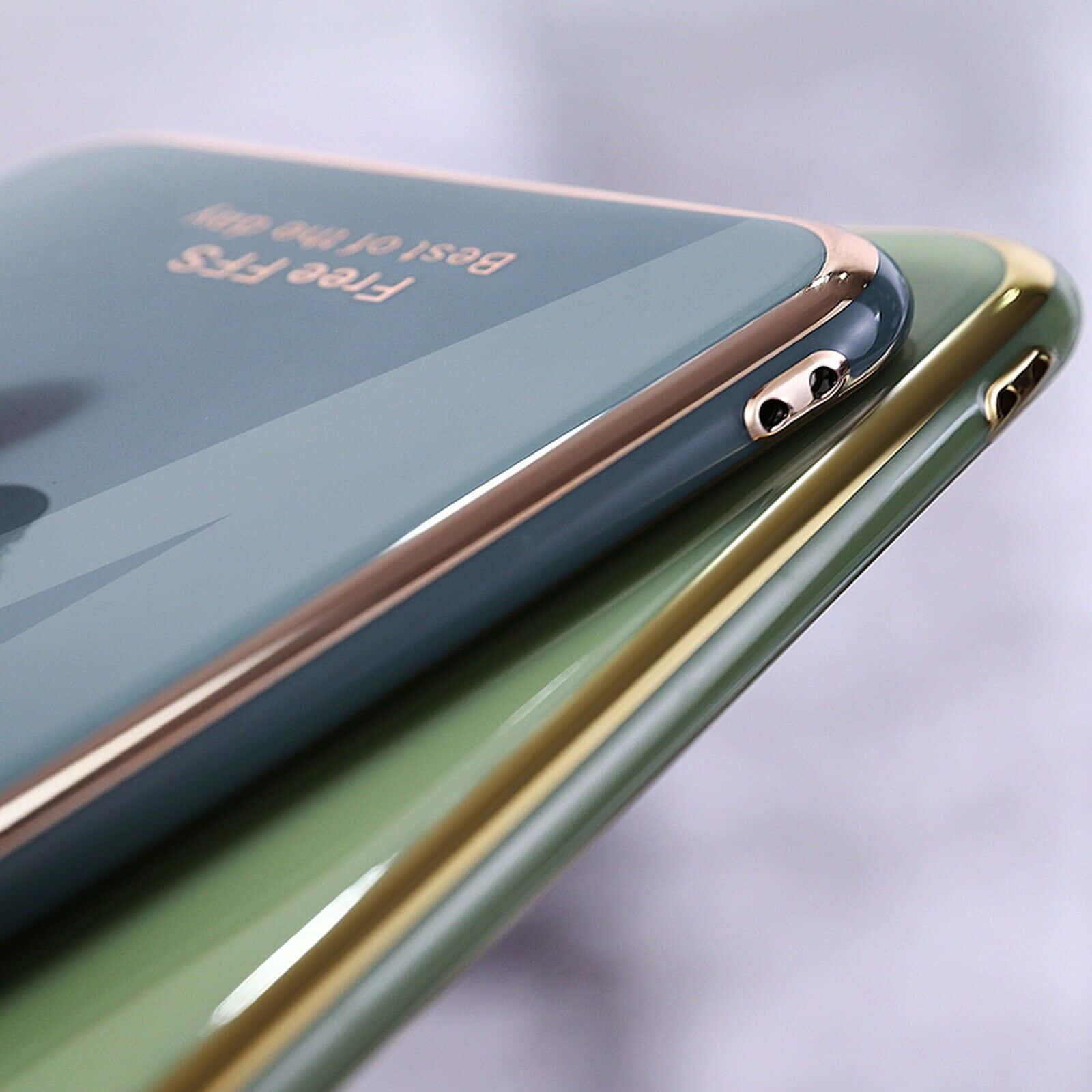 A Close Up Of An Iphone With A Gold And Green Cover