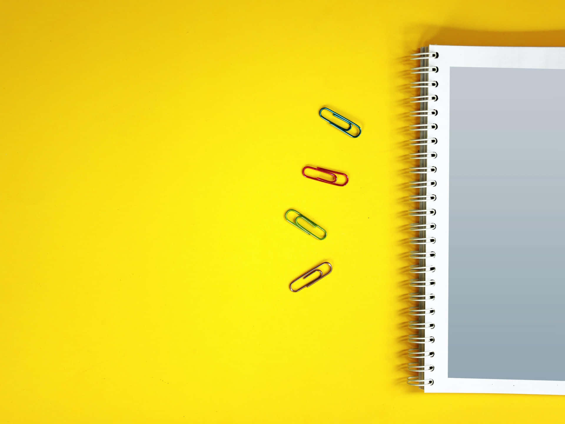 Paper Clips And Notebook Paper Background
