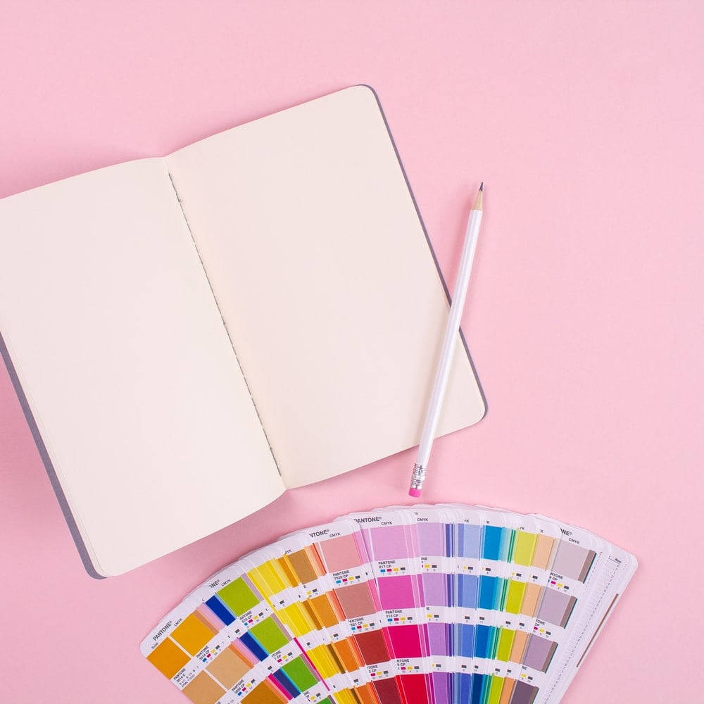 Notebook With Color Palette For Content Creation Wallpaper