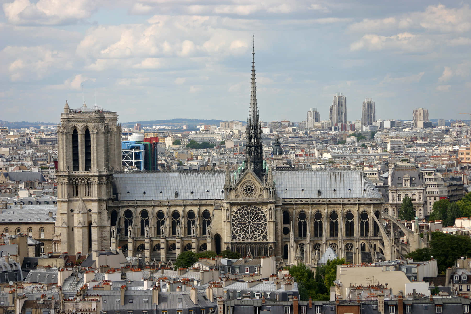 Notre Dame Cathedral With Grey Paris Buildings Wallpaper