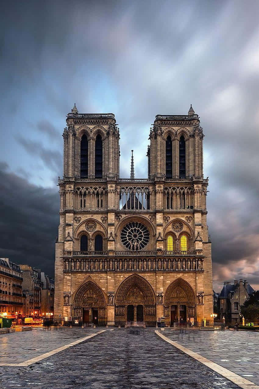 Notre Dame Cathedral With One Tower Light Wallpaper