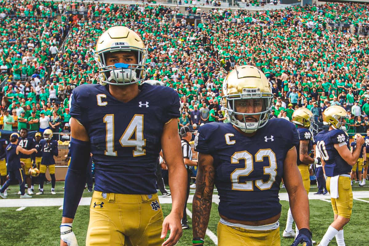 Notre Dame Football Players On Field Wallpaper