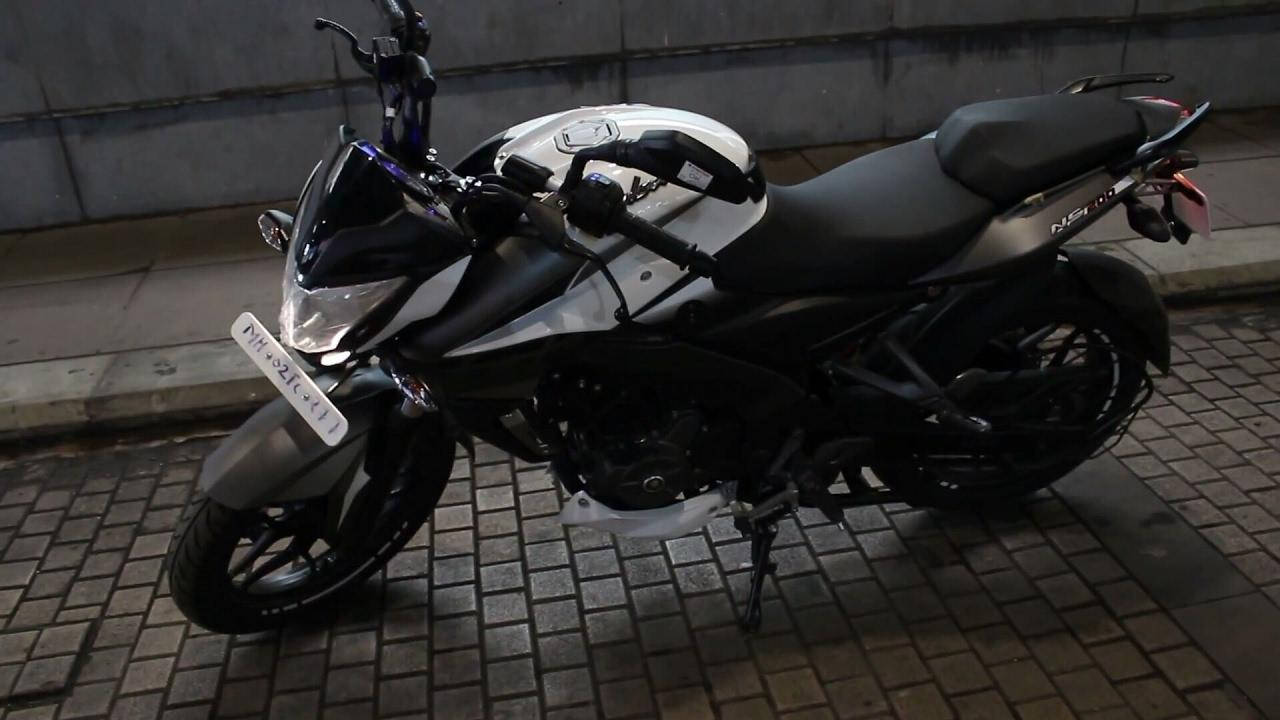 NS 200 Black Motorcycle On Cobblestone Wallpaper