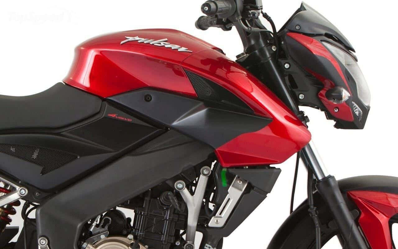 A Red And Black Motorcycle Is Parked On A White Background