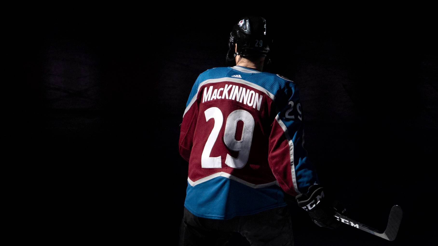 Download Red And Blue Nathan MacKinnon Wallpaper