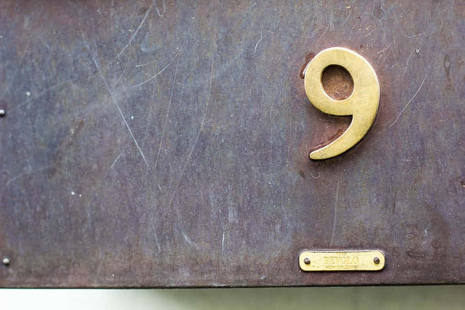 A Metal Box With A Number 9 On It Wallpaper