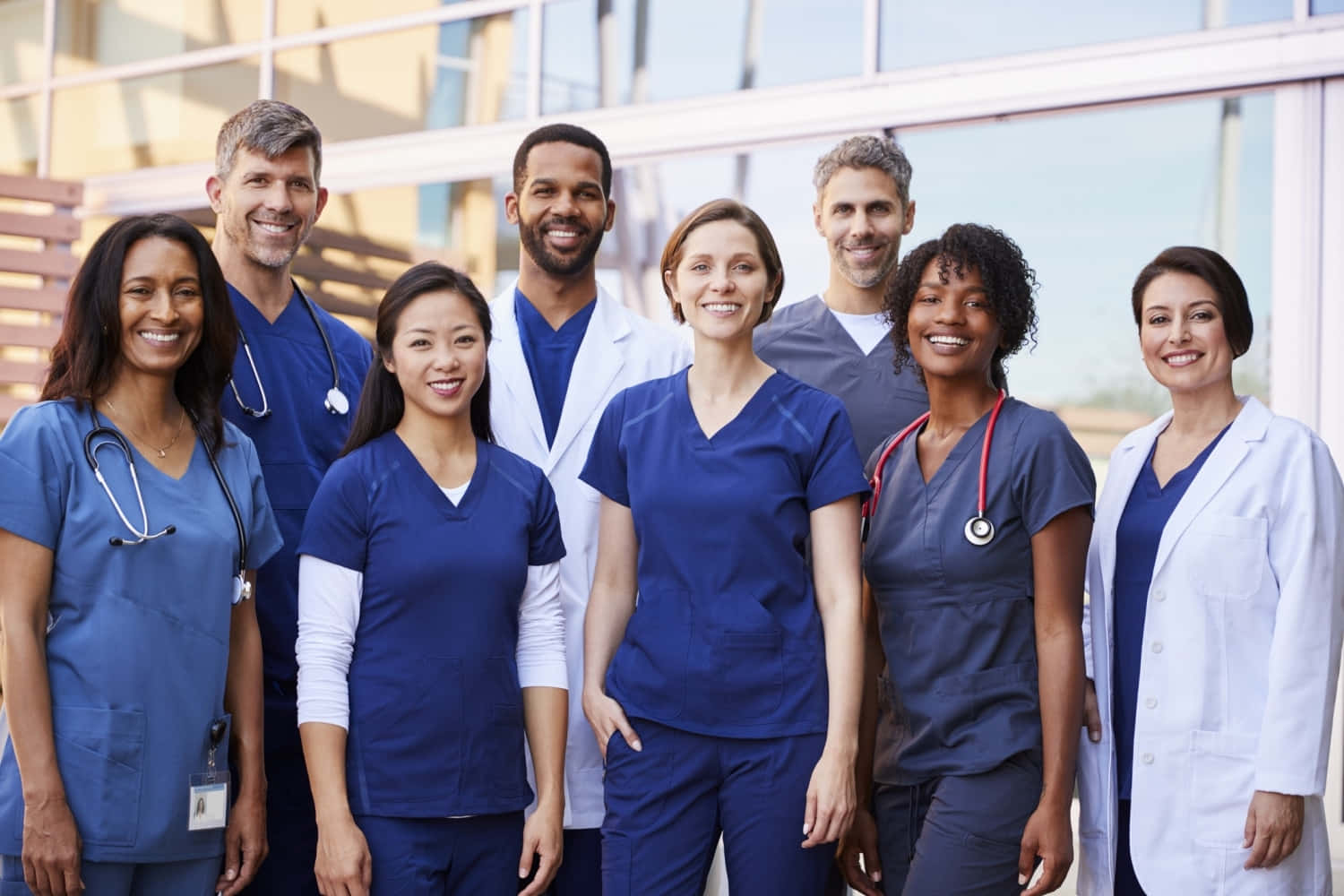 A Group Of Nurses Standing In Front Of A Building