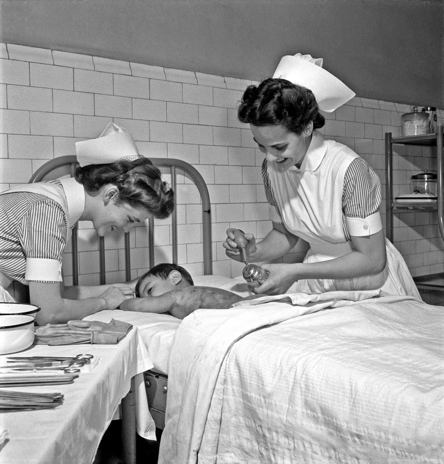 A Nurse Is Putting A Child To Sleep