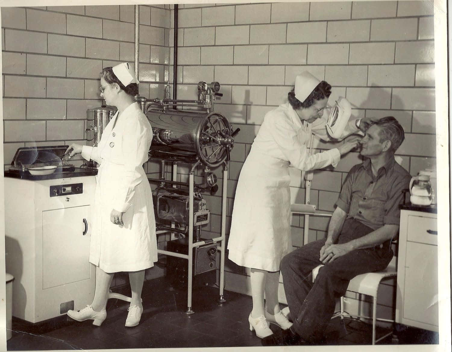 A Nurse Is Examining A Man