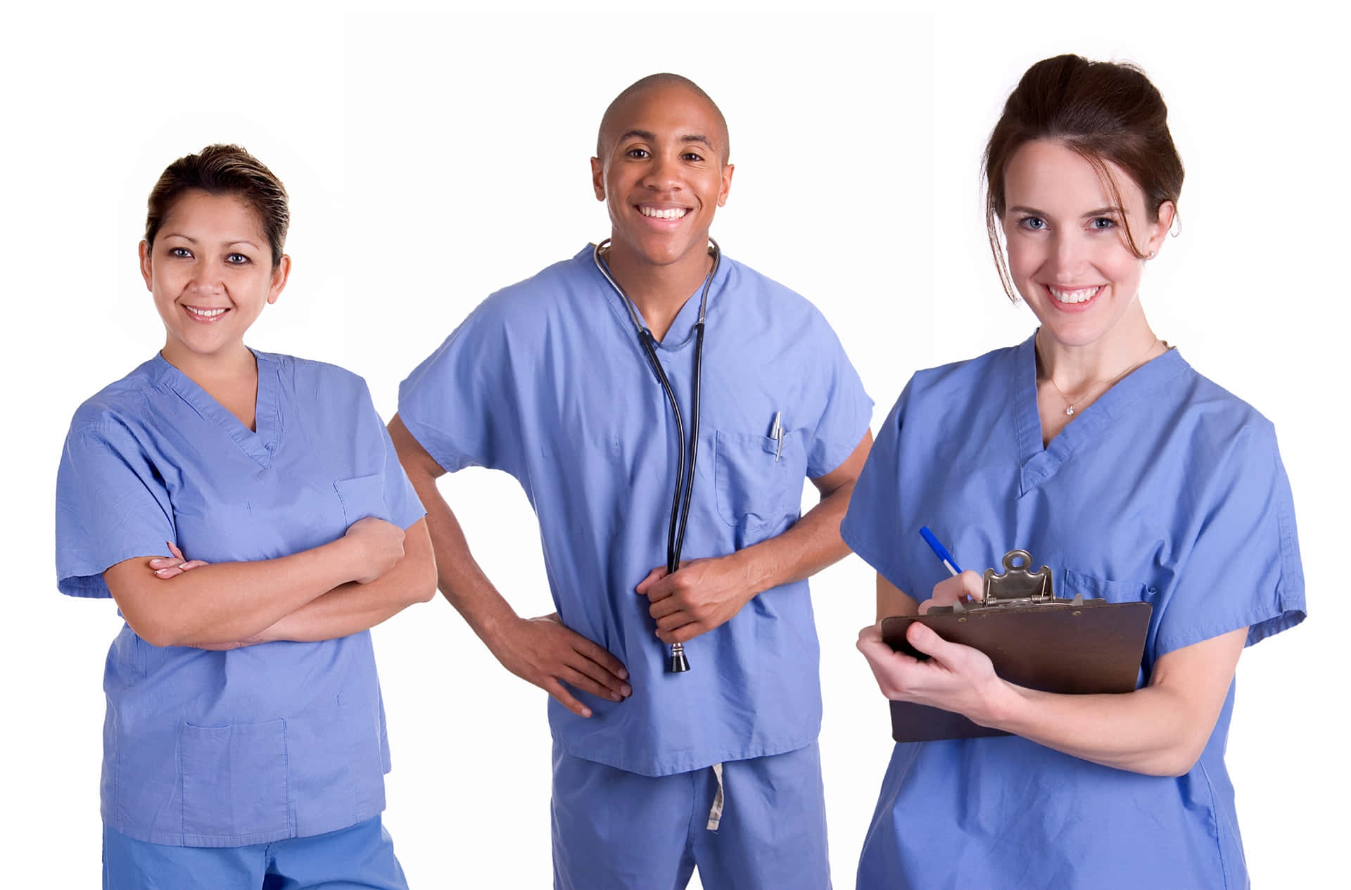 Four Nurses In Scrubs Standing Together