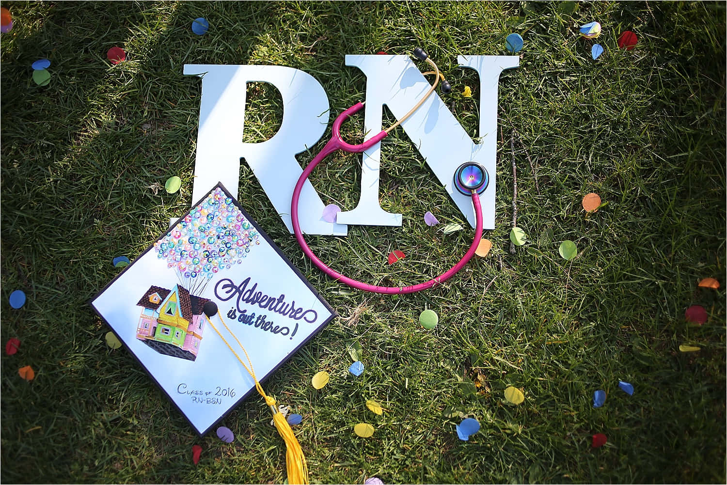 A Graduation Cap And A Stethoscope On The Grass
