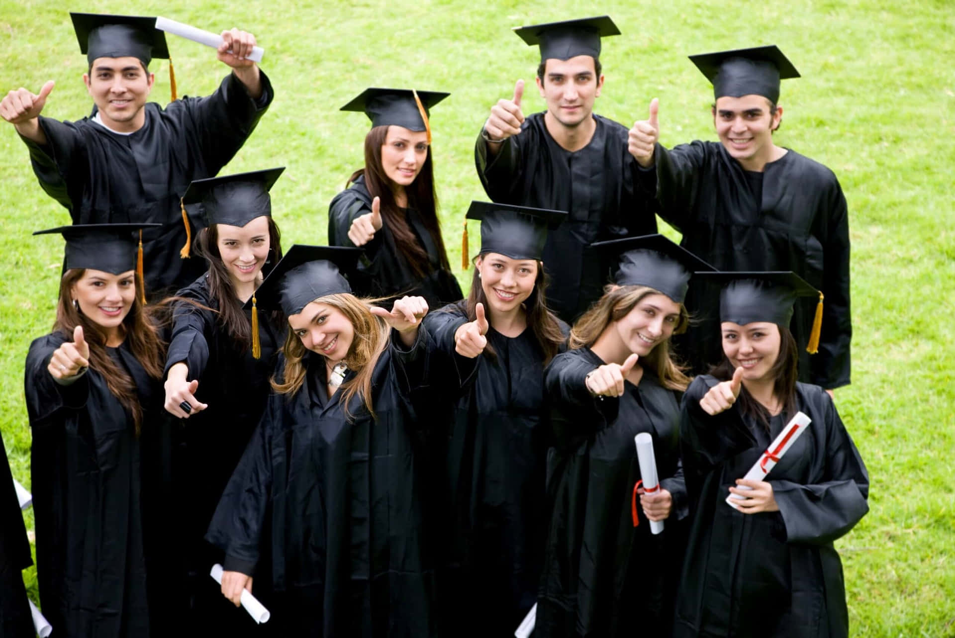 A Group Of Graduates Posing For A Picture