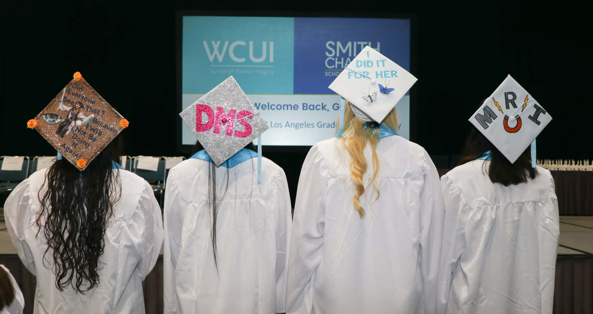 Wccu Graduates Wear Graduation Caps With Their Names On Them