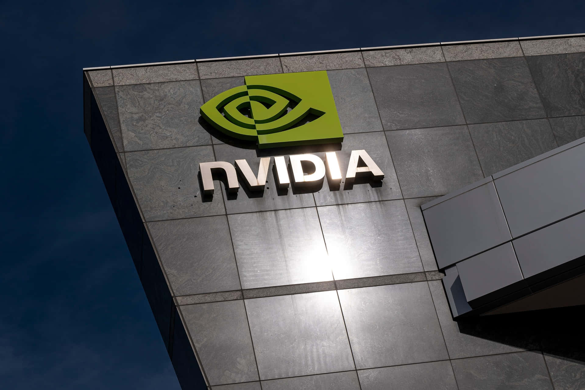 Nvidia Logo On A Building With A Blue Sky