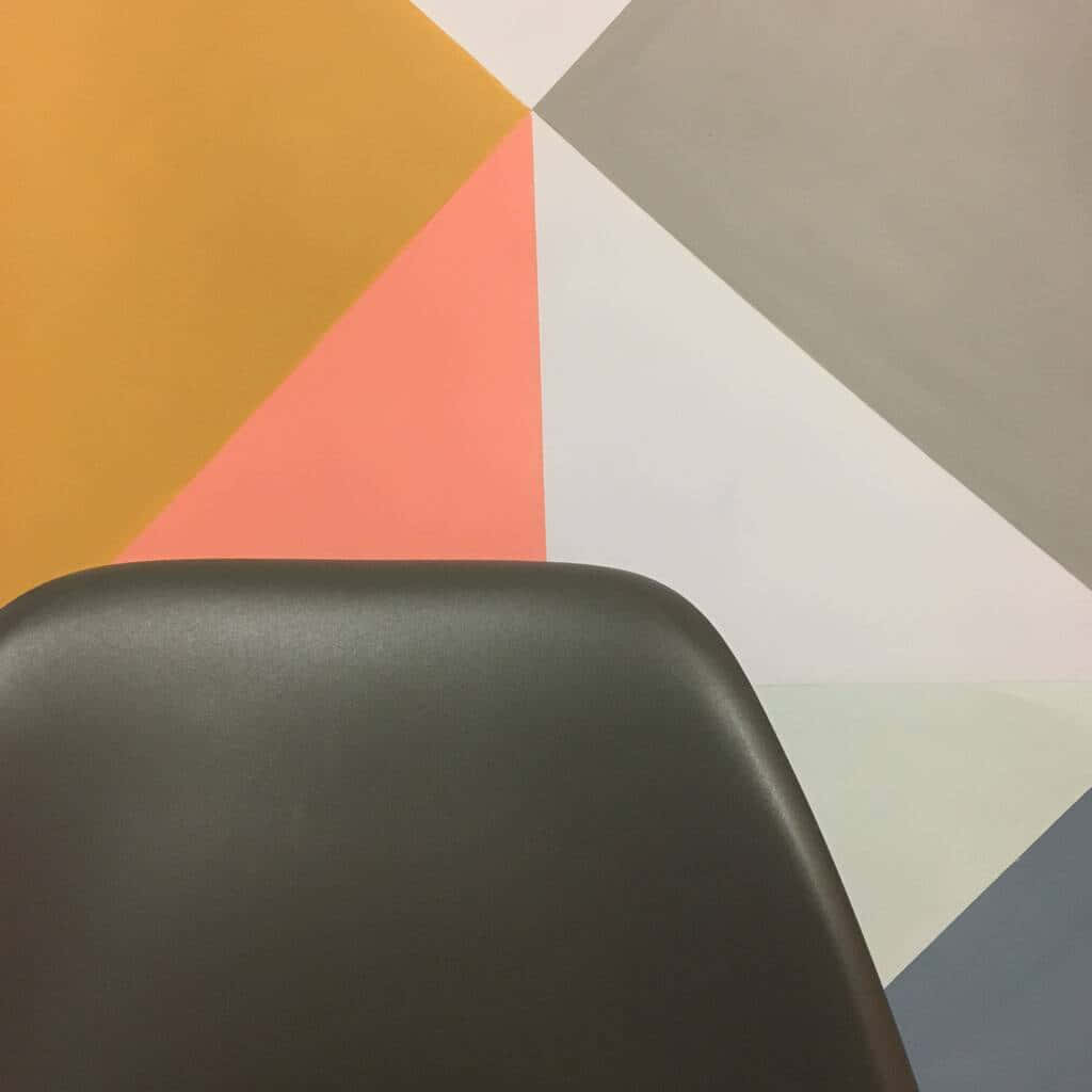 Obtuse Pattern Obscured By The Chair Wallpaper