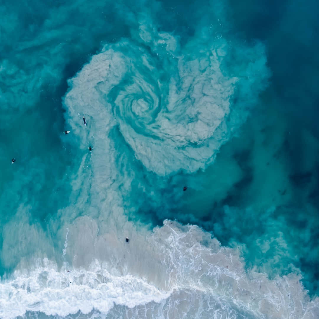 A Blue Swirl Of Water In The Ocean