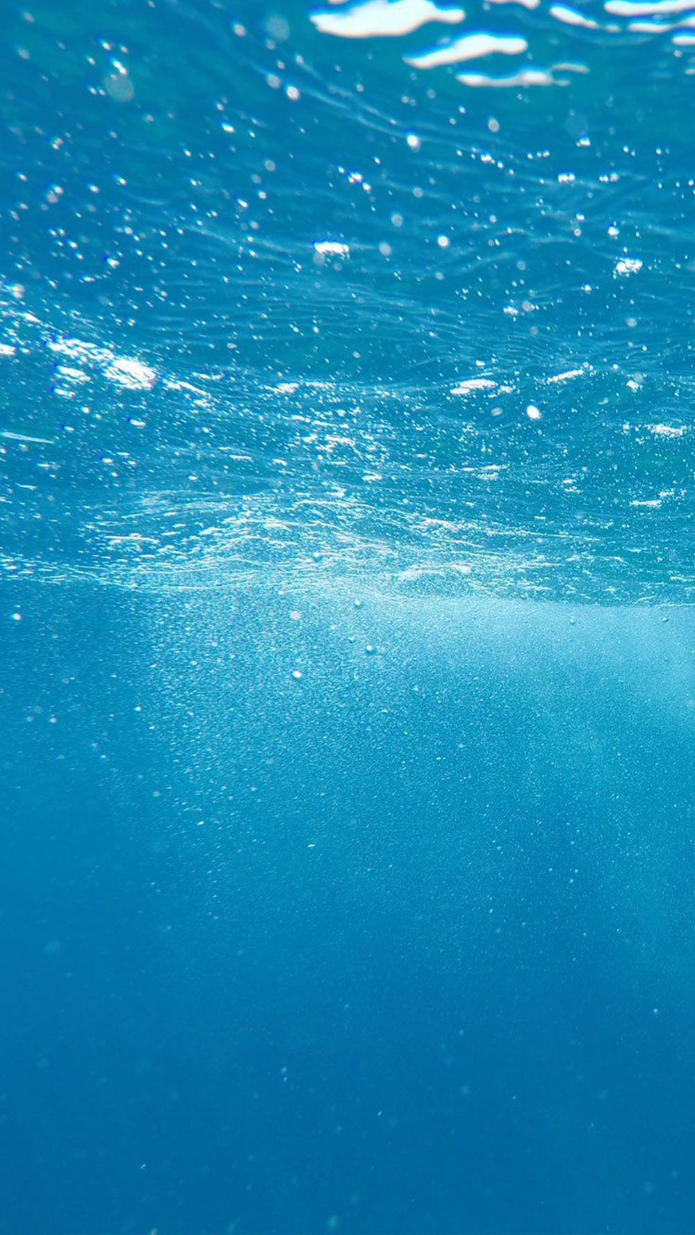 Genießedie Schönheit Des Ozeans Mit Diesem Erstaunlichen Iphone-hintergrundbild. Wallpaper