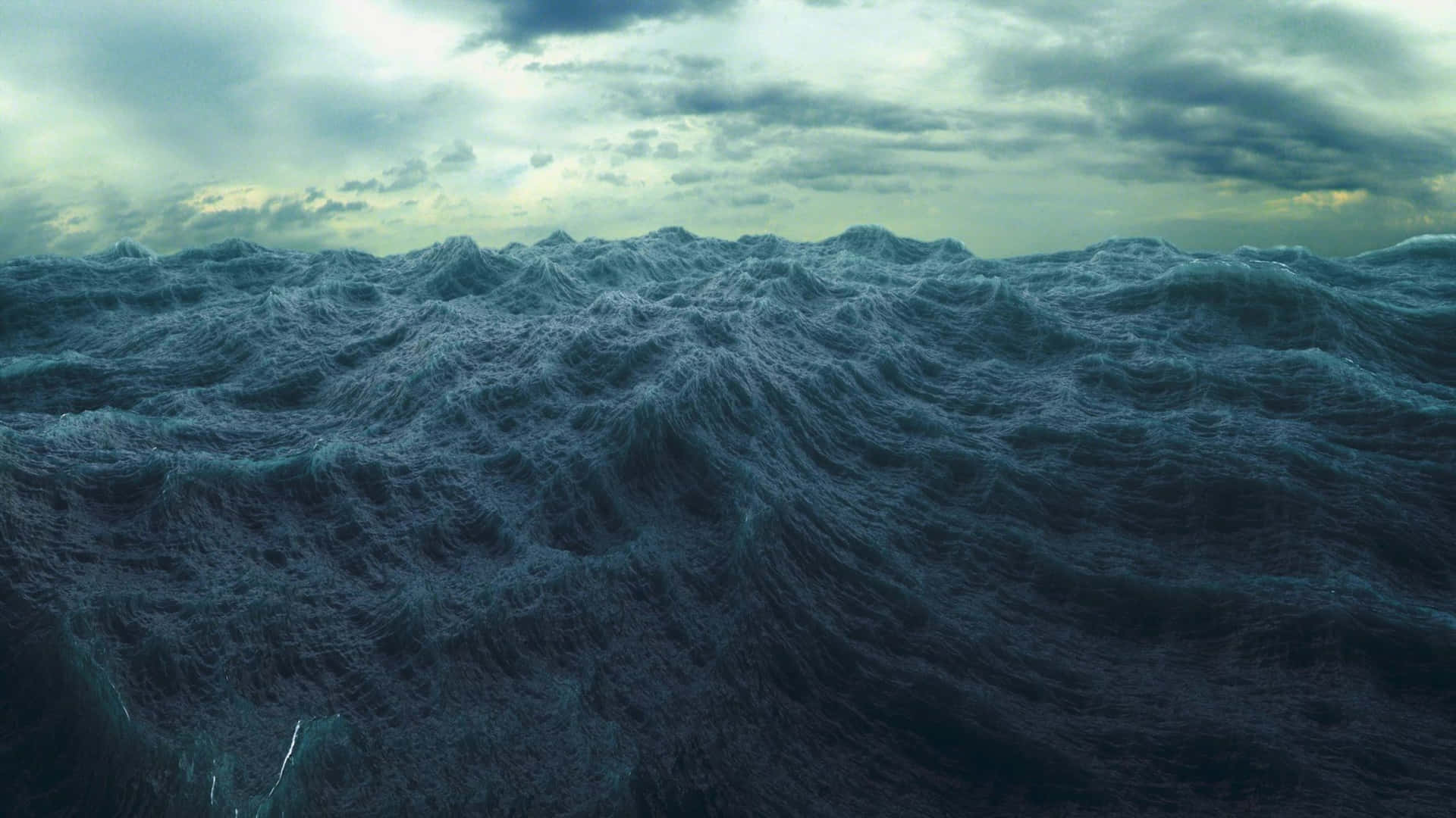 Fantastisk udsigt til en mørk, stormfuld ocean Wallpaper