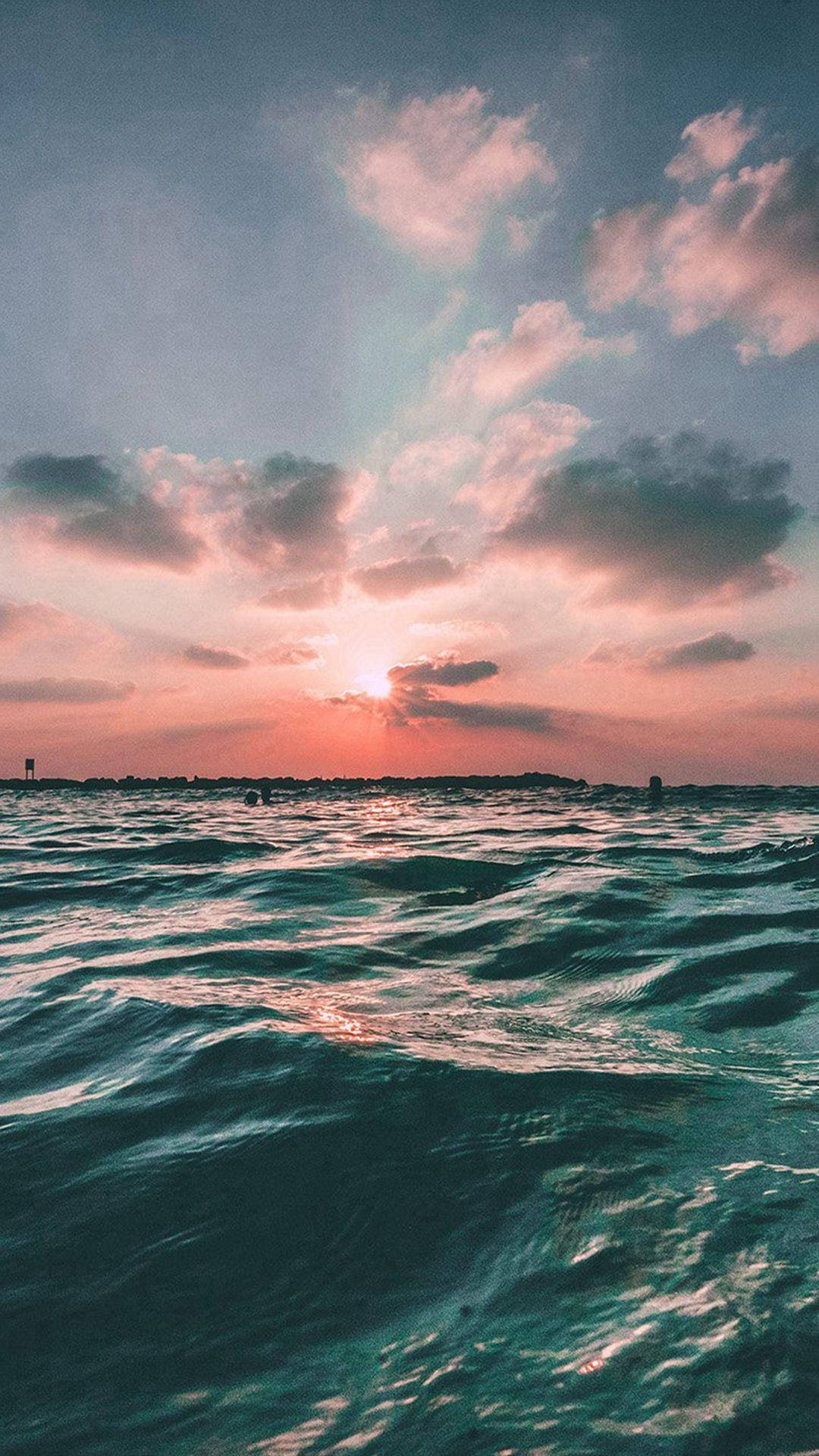 "Enchanting Ocean Sunset View from an iPhone" Wallpaper