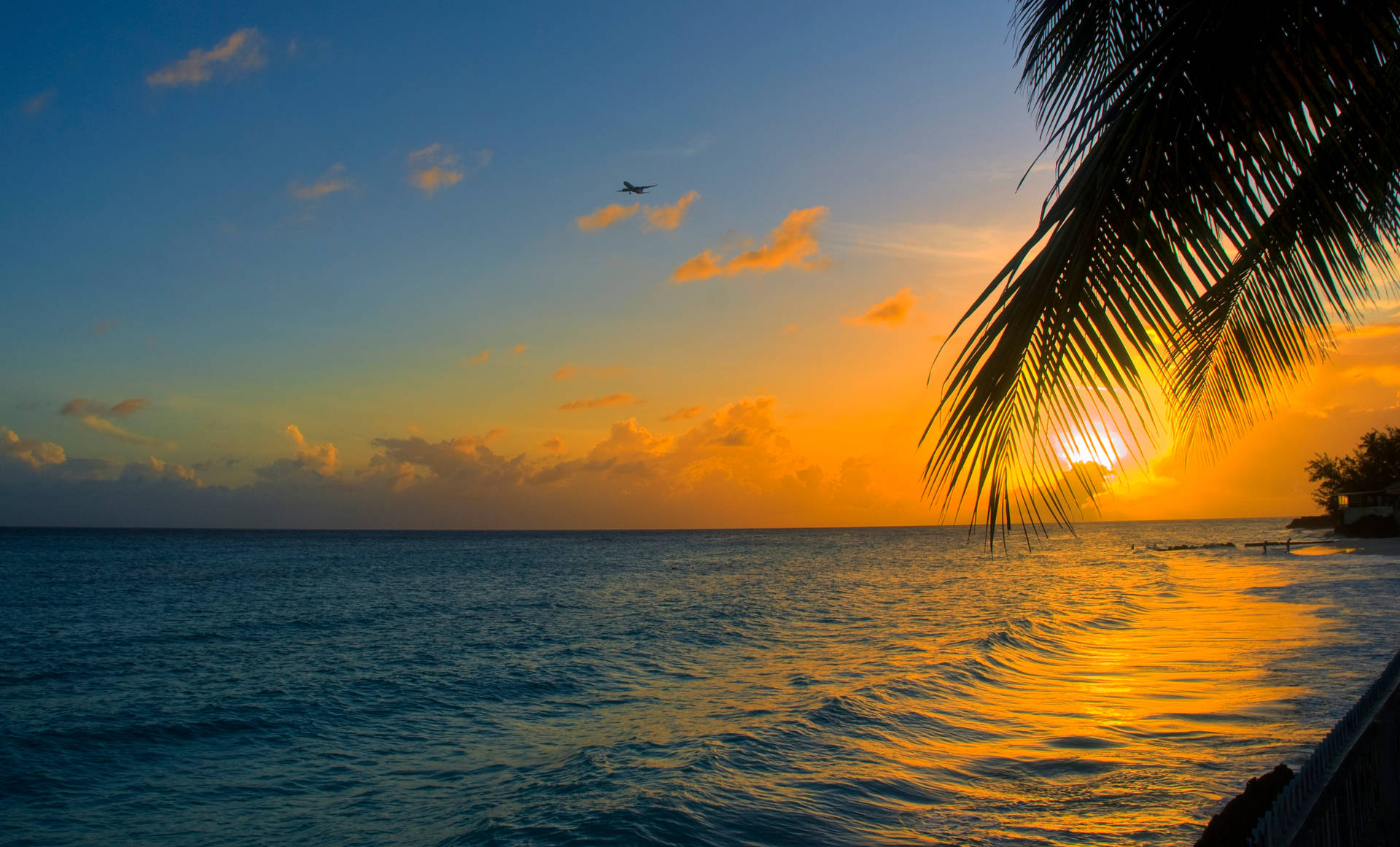 Enjoying a beautiful sunset over the calm oceans Wallpaper