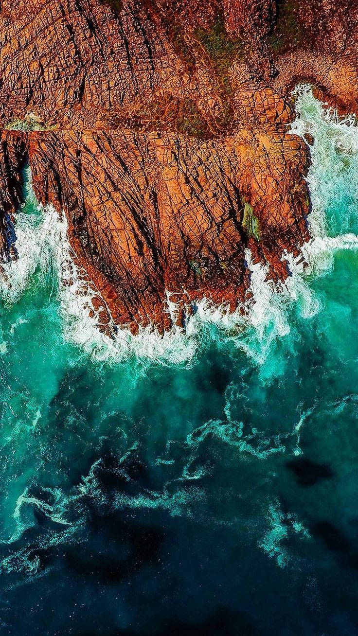 Ocean waves crashing into the shore Iphone wallpaper