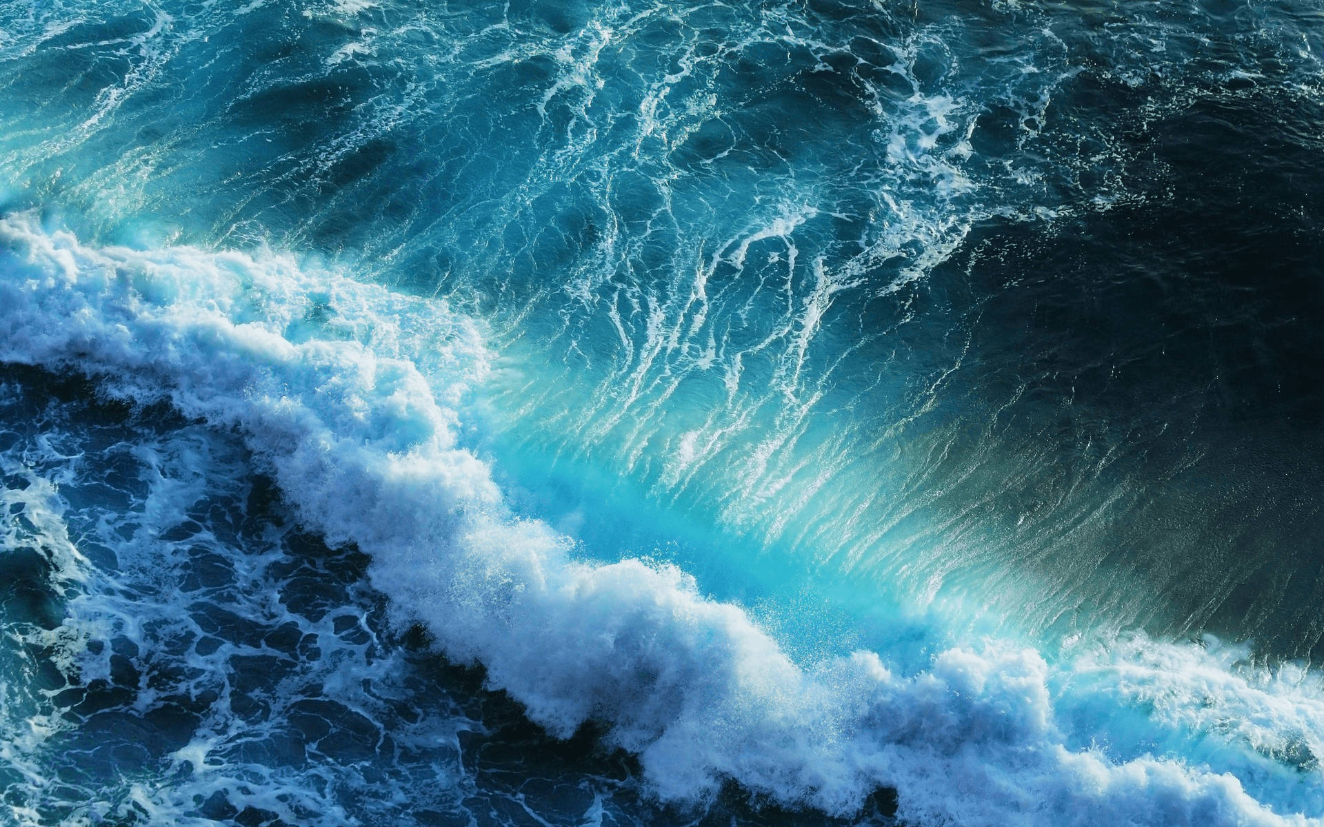 Feel the power of the ocean waves, captured in their pristine beauty Wallpaper