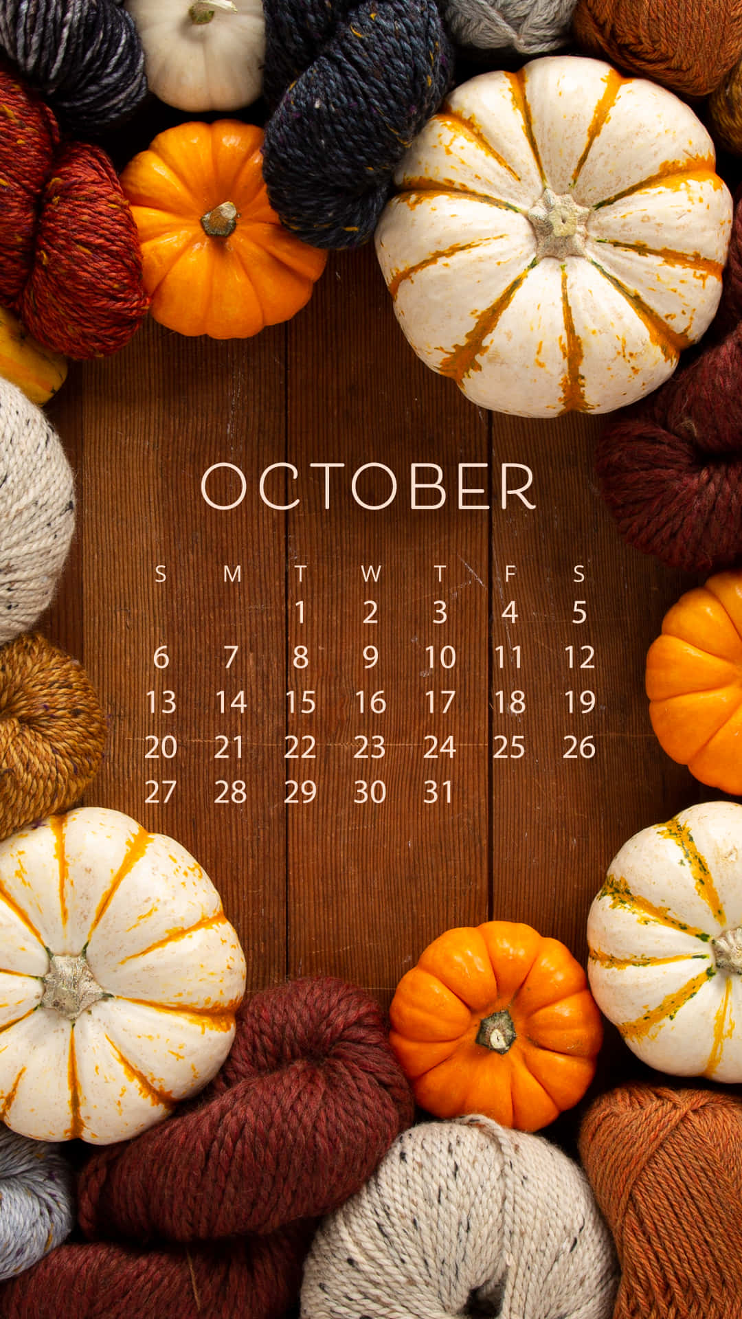 A Calendar With Pumpkins And Yarn Wallpaper