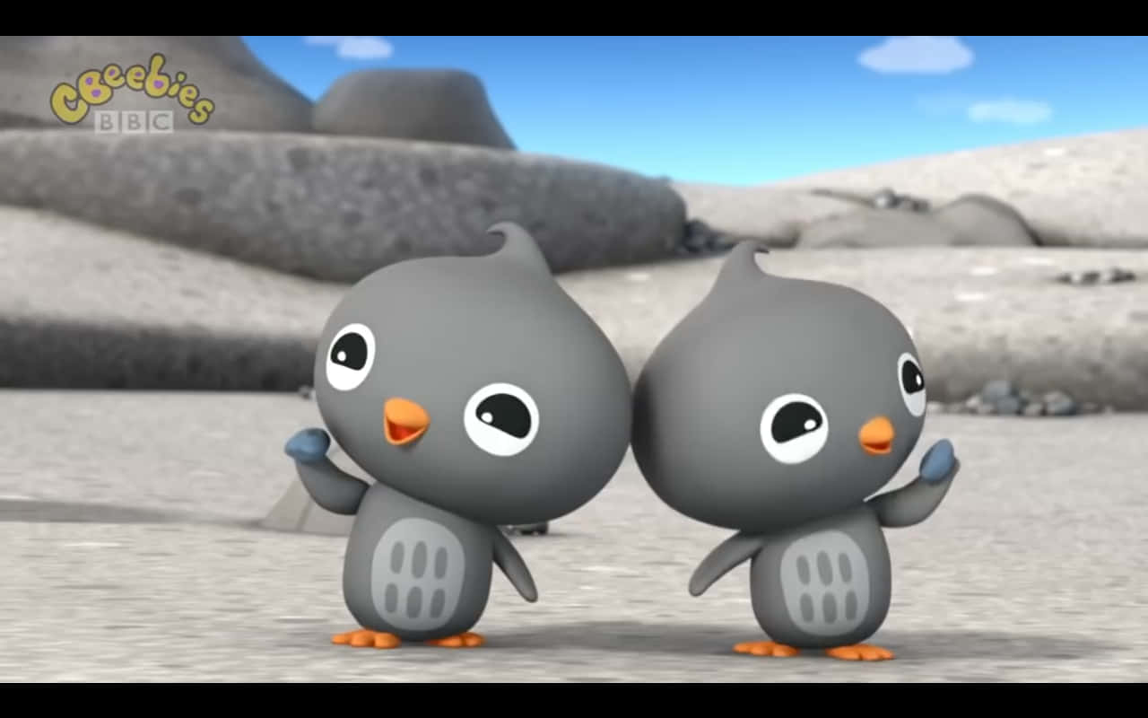 Two Cartoon Birds Standing In The Desert Wallpaper