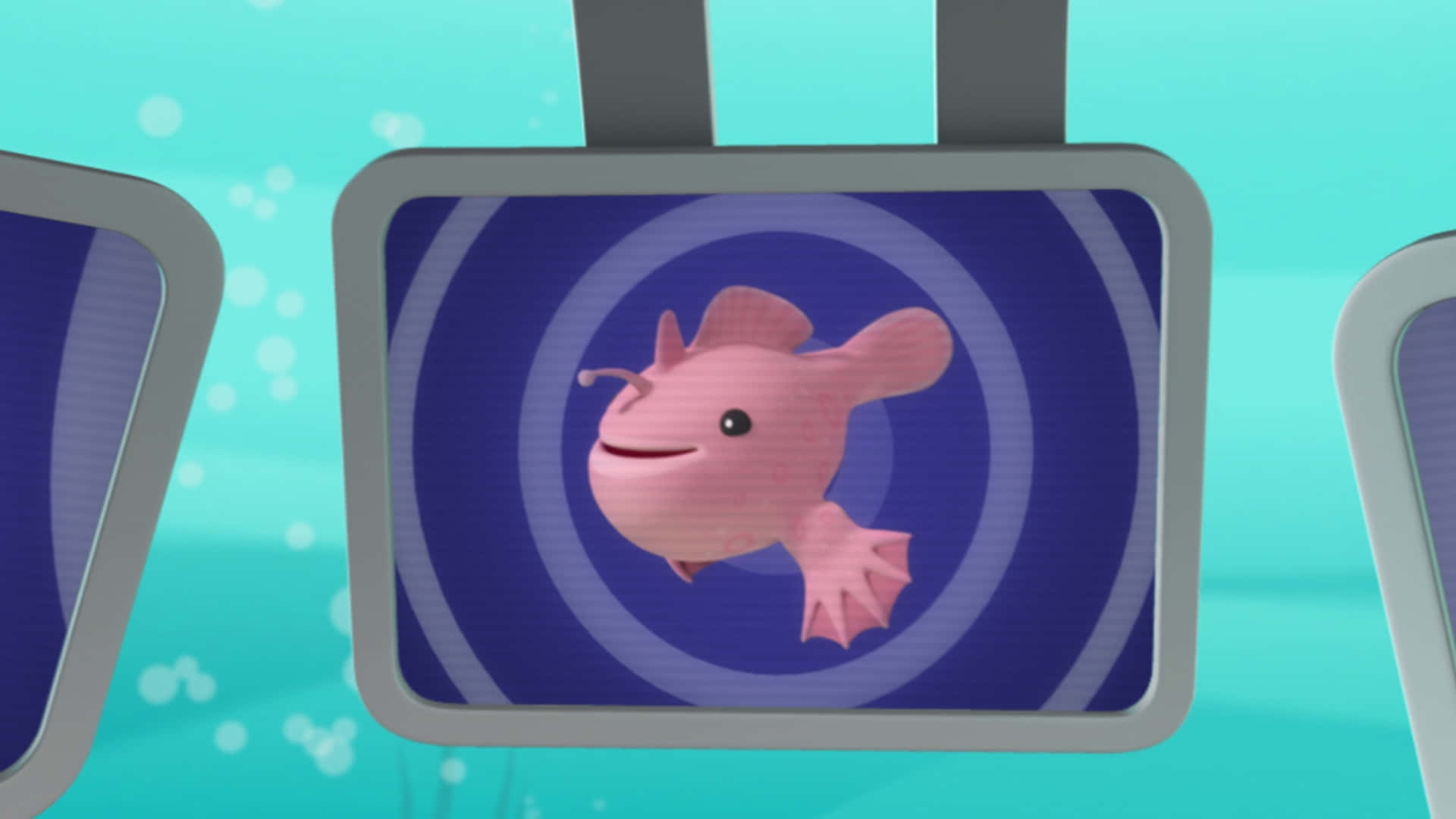 A Pink Fish Is Hanging From Two Screens Wallpaper