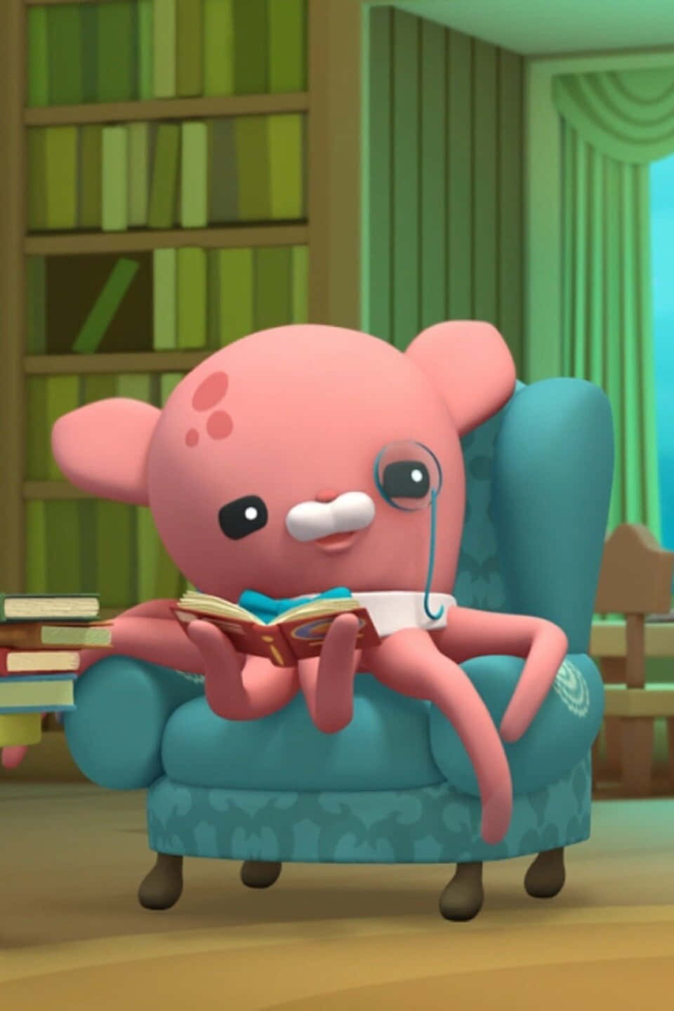 A Pink Octopus Sitting In A Chair Reading A Book Wallpaper
