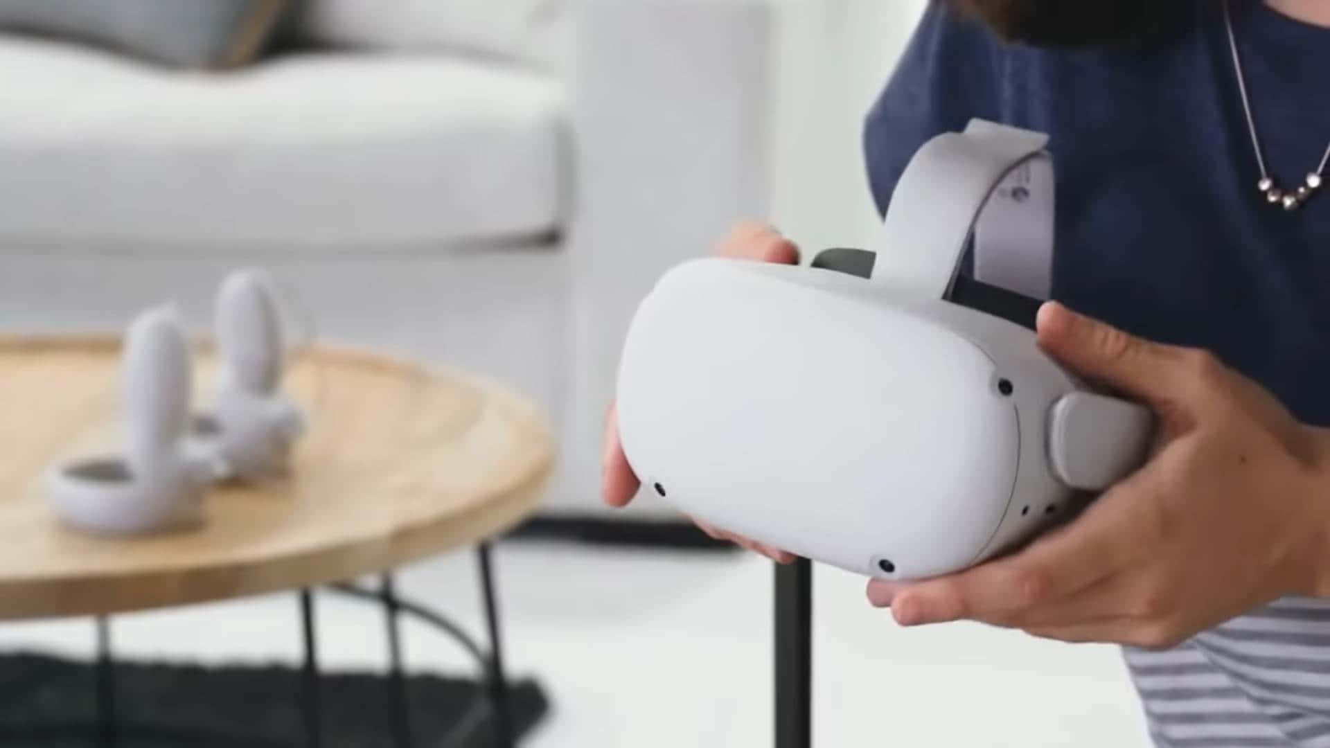 A Woman Is Holding A White Vr Headset