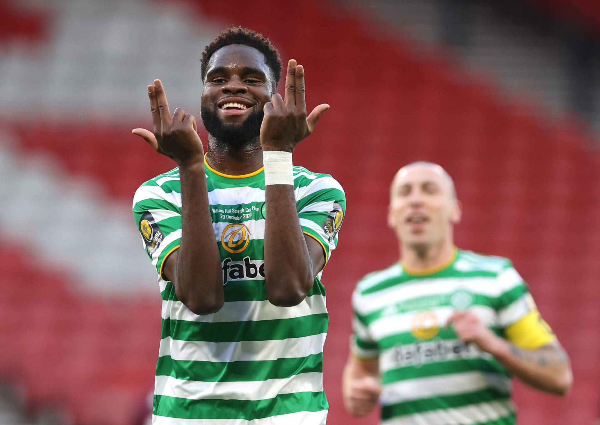 Odsonne Edouard Smiling With Hand Gestures Wallpaper